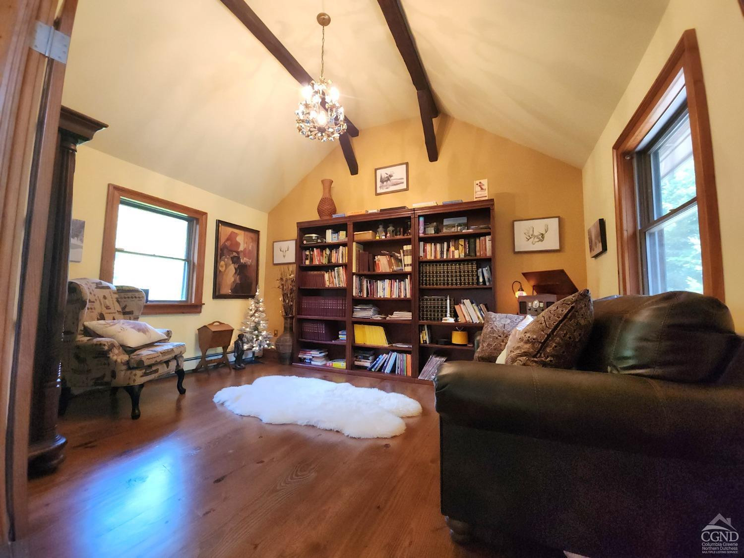 159 Toles Hollow Road Conesville, NY 12076 - Photo 24 of 53 a living room with furniture and a wooden floor