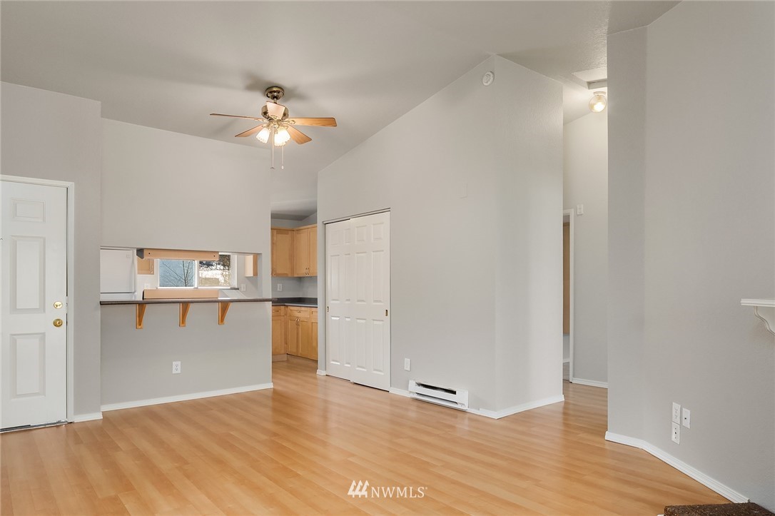 10838 East Riverside Drive, Unit C301 Bothell, WA 98011 - Photo 7 of 23 a view of a kitchen with a sink and a refrigerator