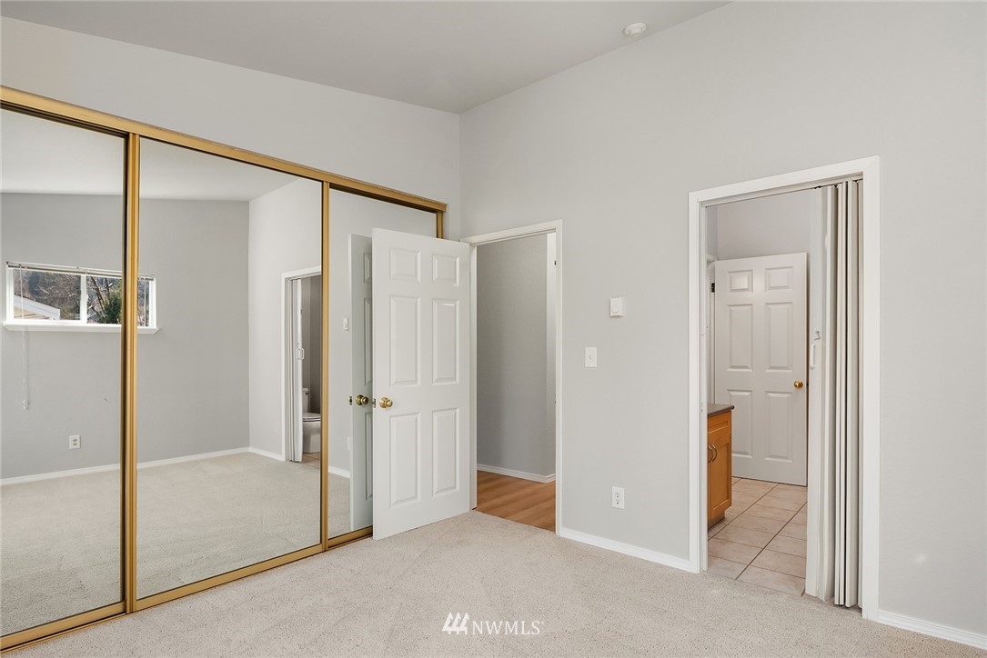 10838 East Riverside Drive, Unit C301 Bothell, WA 98011 - Photo 9 of 23 a bathroom with a shower and a glass door