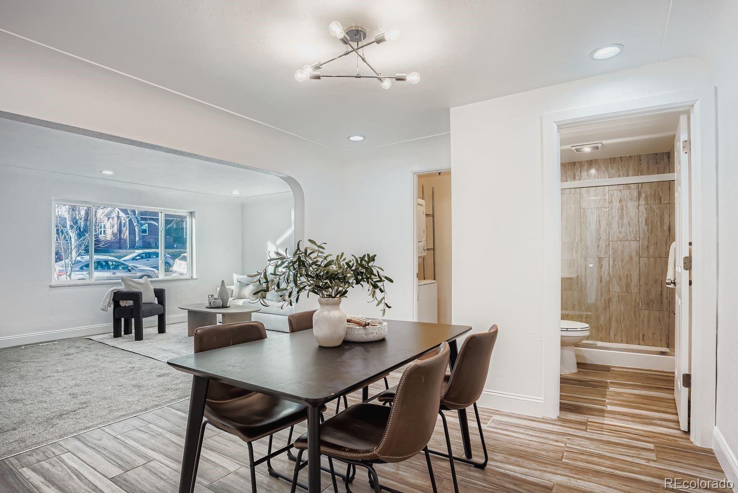 3822 Julian Street Denver, CO 80211 - Photo 7 of 28 a view of a dining room with furniture and wooden floor