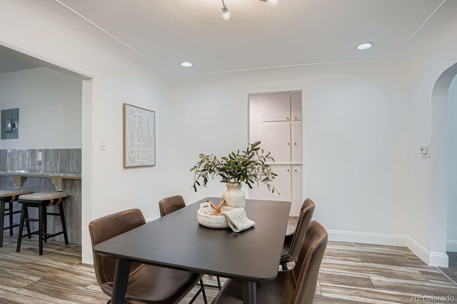 3822 Julian Street Denver, CO 80211 - Photo 9 of 28 a view of a dining room with furniture and wooden floor