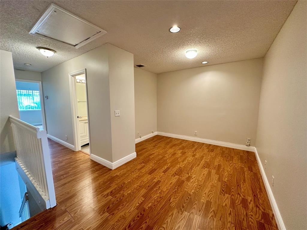 5660 Northwest 98th Way Coral Springs, FL 33076 - Photo 12 of 25 wooden floor in an empty room with wooden floor