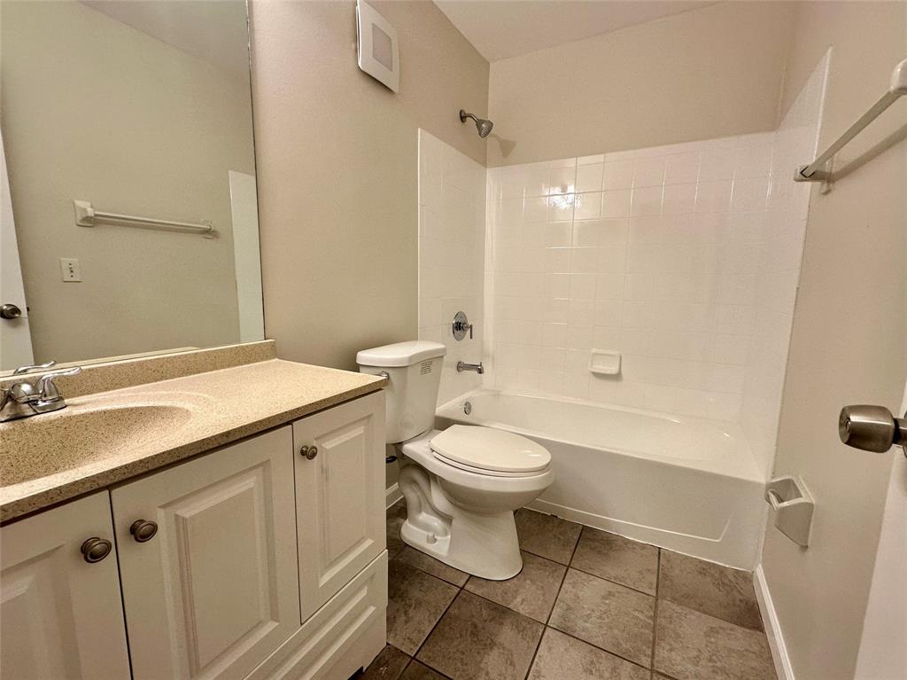 5660 Northwest 98th Way Coral Springs, FL 33076 - Photo 13 of 25 a bathroom with a granite countertop sink toilet and shower