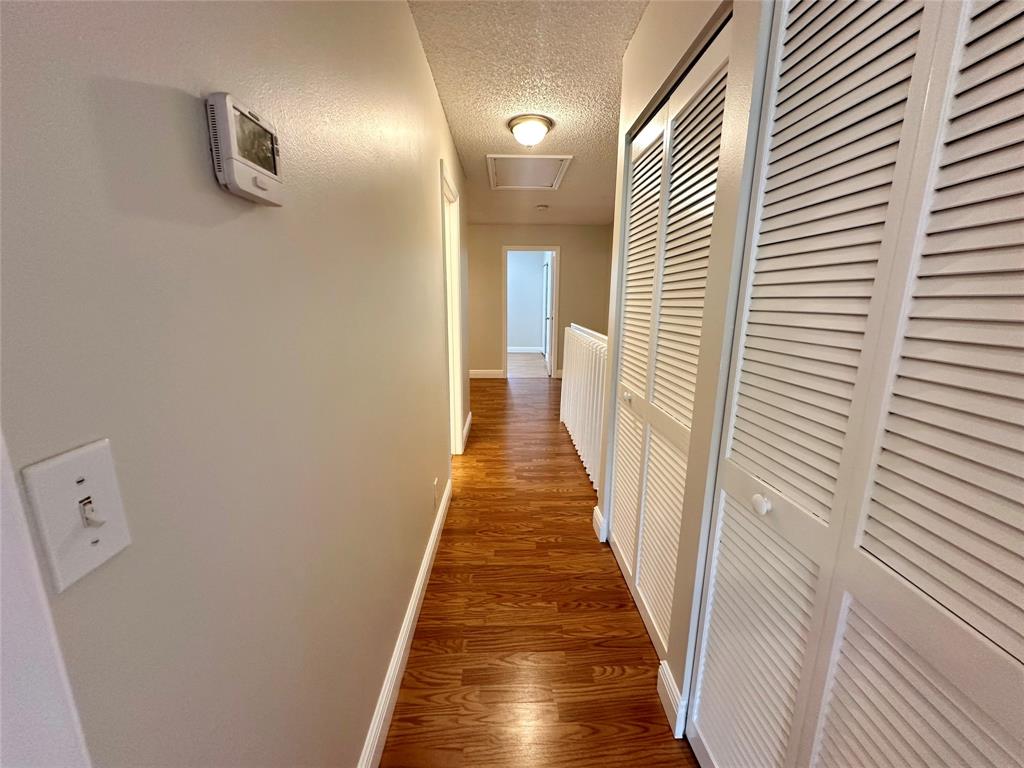 5660 Northwest 98th Way Coral Springs, FL 33076 - Photo 18 of 25 a view of a hallway with wooden floor