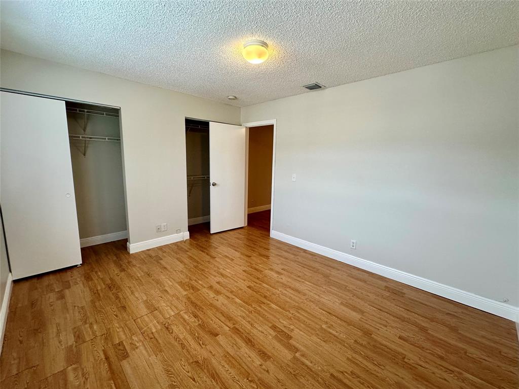 5660 Northwest 98th Way Coral Springs, FL 33076 - Photo 10 of 25 a view of an empty room with wooden floor