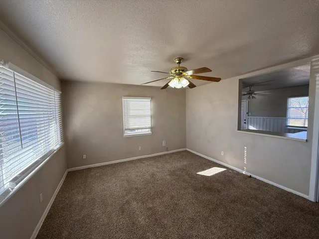a view of an empty room with a window