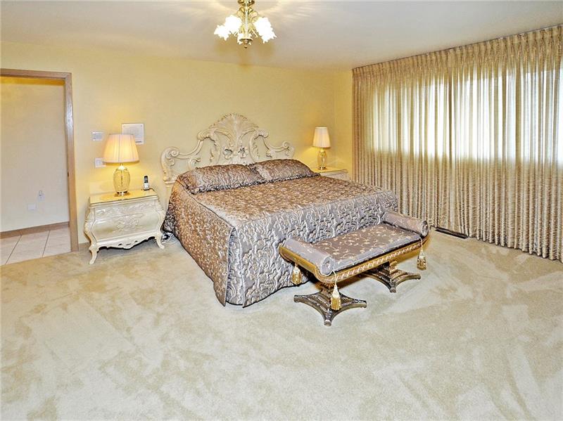 201 Harrison Road Turtle Creek, PA 15145 - Photo 14 of 25 Huge master bedroom ensuite features whirpool tub, separate dressing area