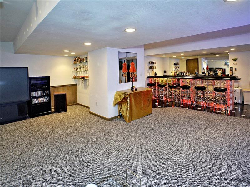 201 Harrison Road Turtle Creek, PA 15145 - Photo 18 of 25 Super large lower level game room with wet bar large TV area and disco ball if so inclined to dance!1