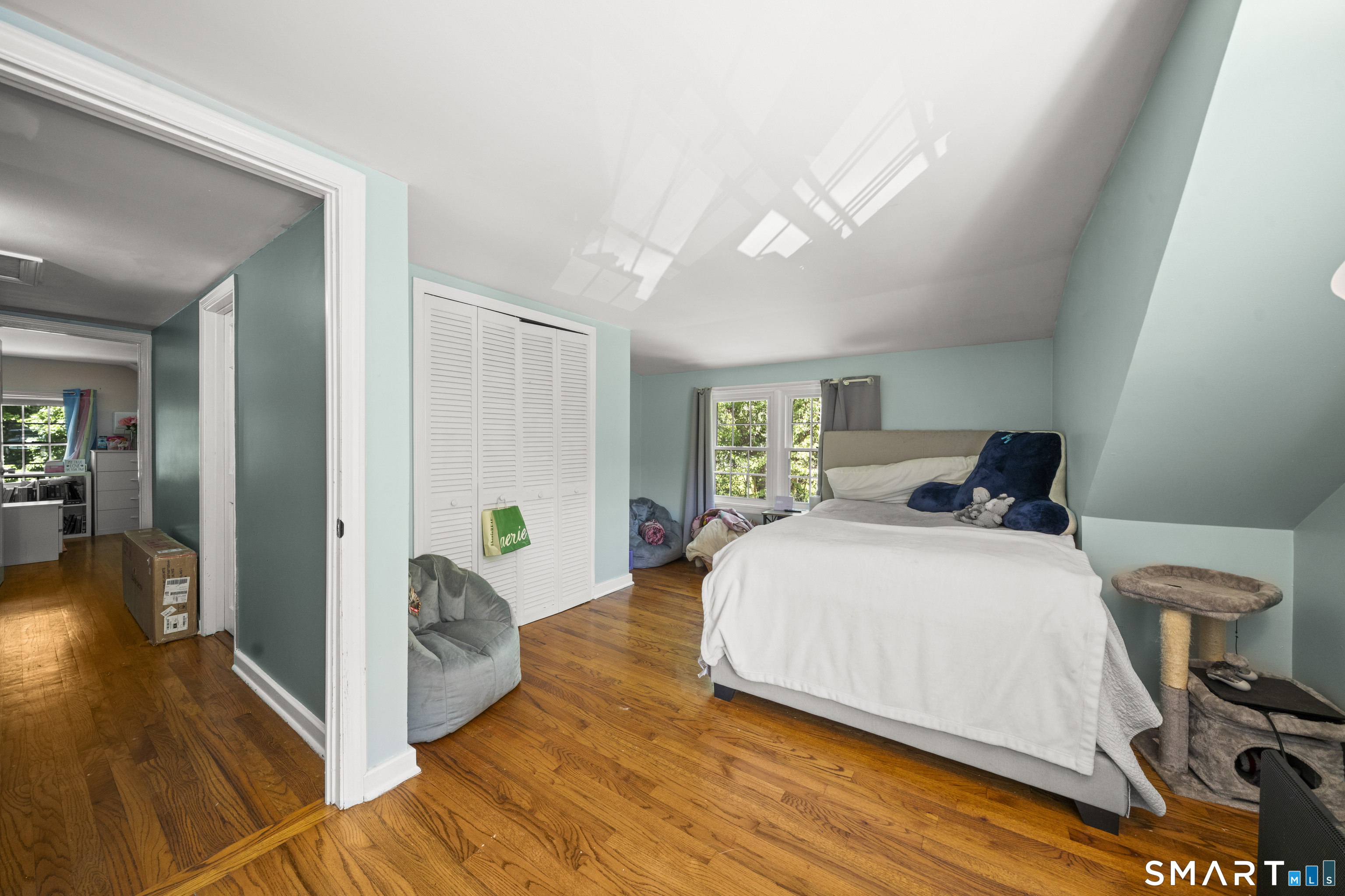 211 Whisconier Road Brookfield, CT 06804 - Photo 22 of 38 a bedroom with a bed and wooden floor