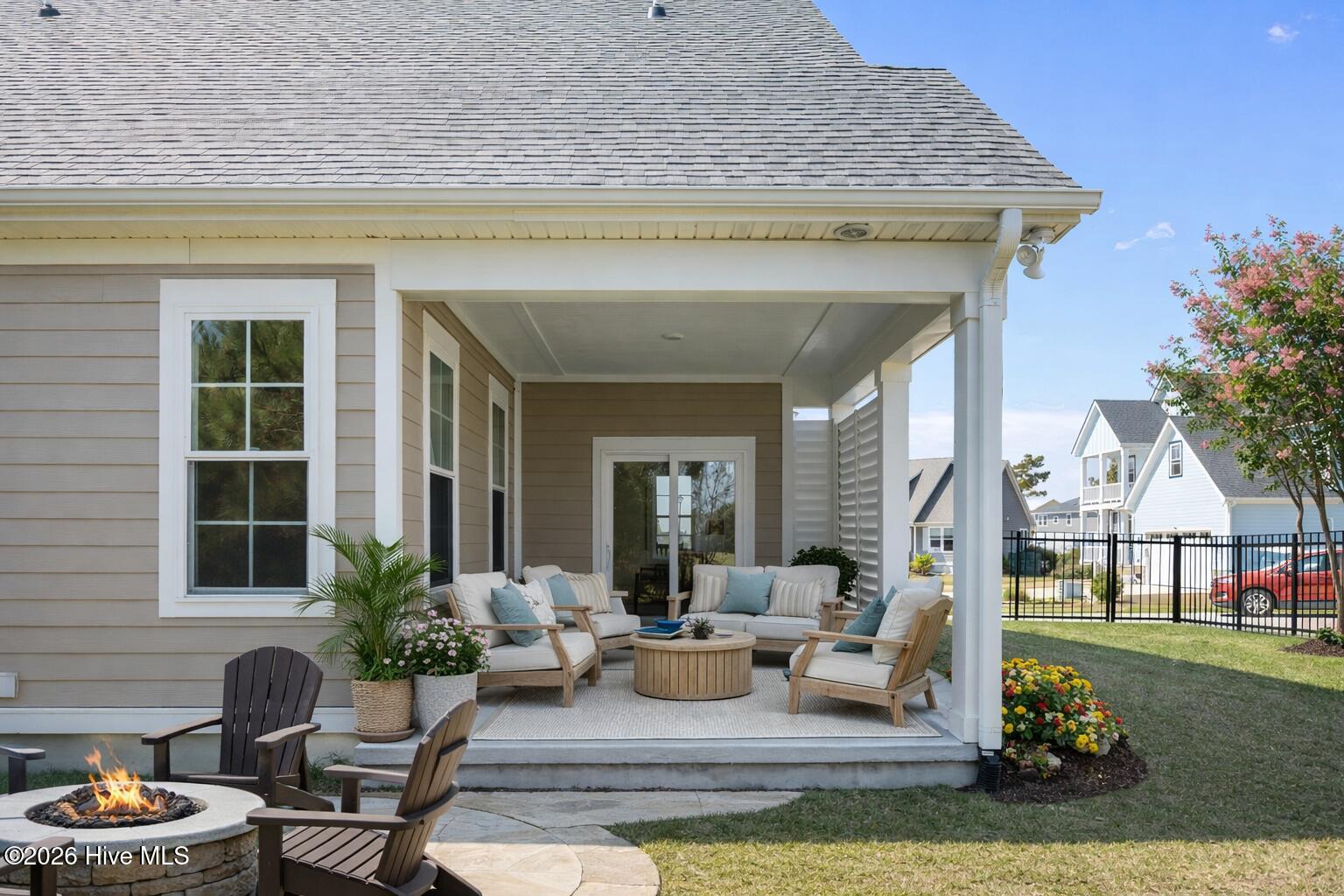 658 Fishermans Point Newport, NC 28570 - Photo 19 of 44 Coastal patio with fire pit and flowers