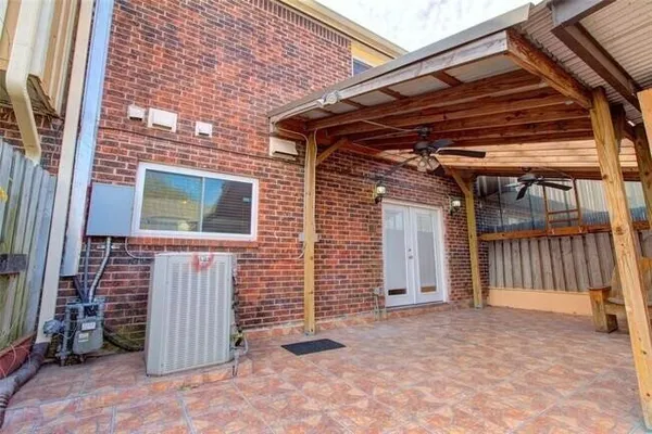 a view of a backyard with wooden fence