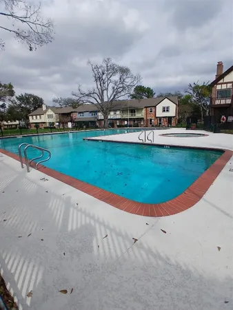 a view of an house with backyard porch and garden