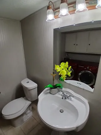 a bathroom with a toilet and a sink