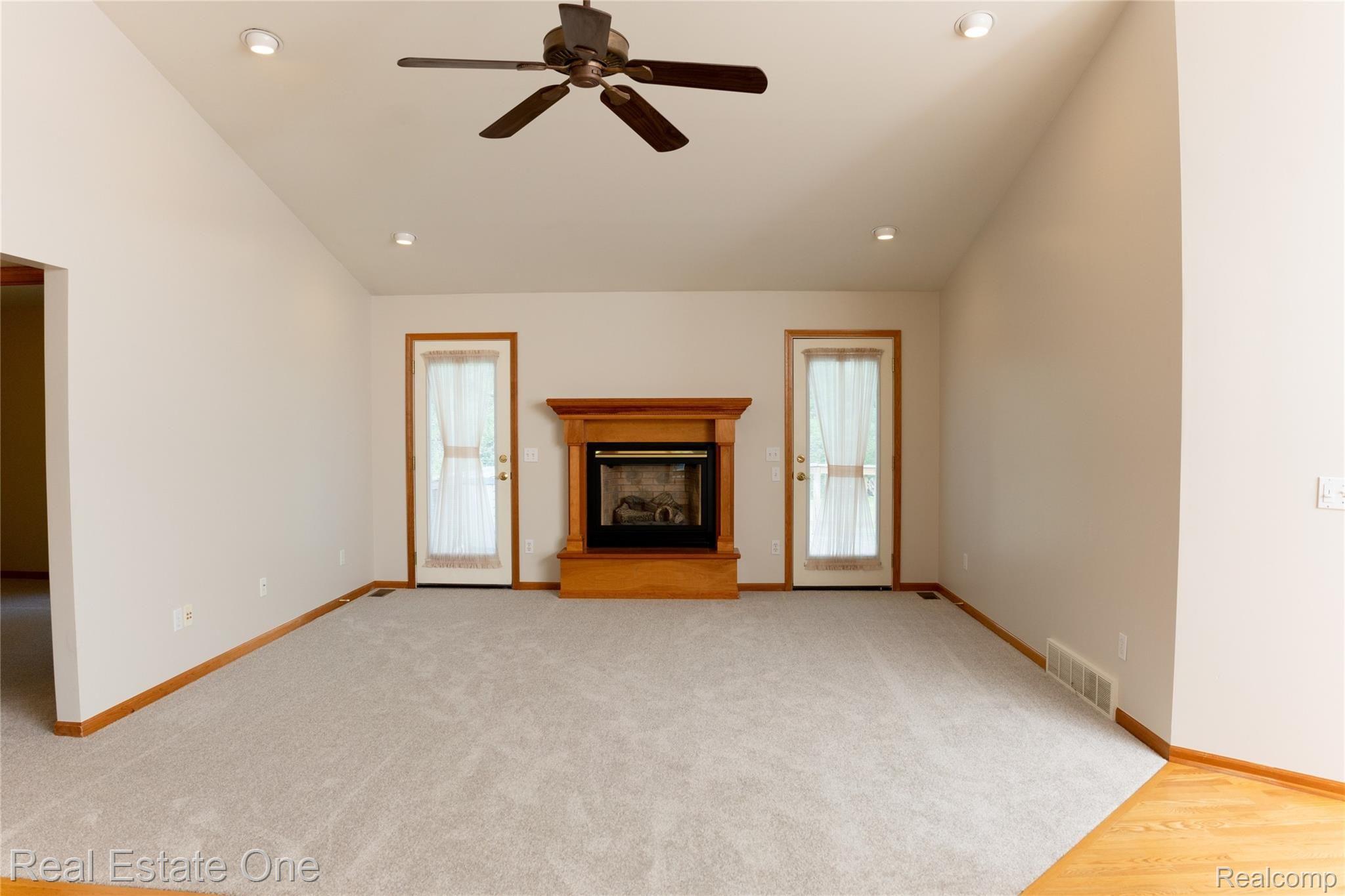 1540 Fish Lake Road Lapeer, MI 48446 - Photo 9 of 24 Notice vaulted ceiling with fan and recessed lighting