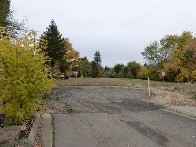 2160 Crestbrook Road, Unit 15 Medford, OR 97504 - Photo 1 of 5 a view of a dirt road with trees in the background