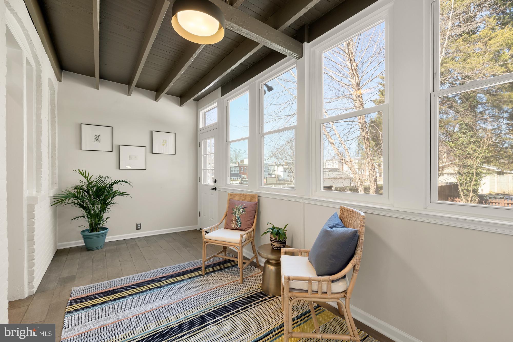 28 Bryant Street Northeast Washington, DC 20002 - Photo 17 of 41 a living room with furniture and a potted plant
