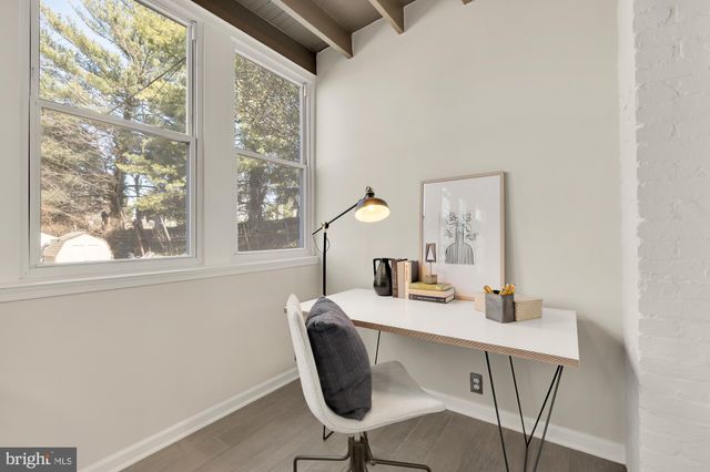 a dining room with a table and chairs