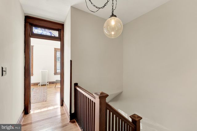 an empty room with wooden floor