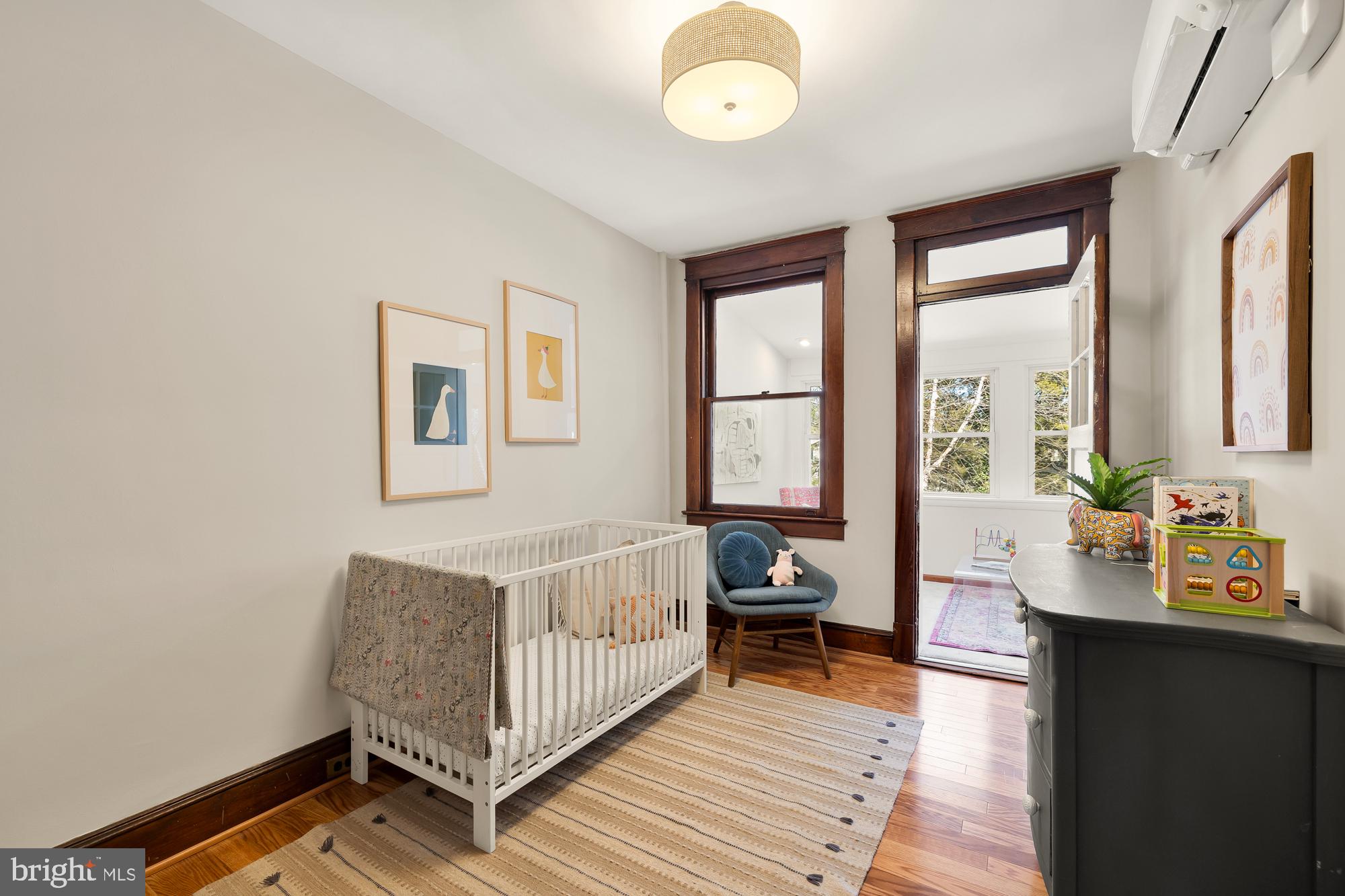 28 Bryant Street Northeast Washington, DC 20002 - Photo 21 of 41 a bedroom with a bed and wooden floor