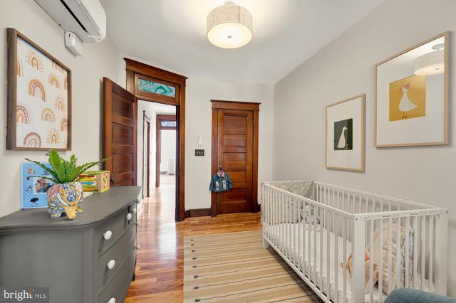 a view of hallway with wooden floor