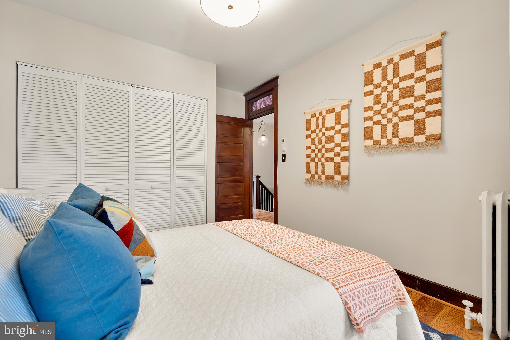 28 Bryant Street Northeast Washington, DC 20002 - Photo 25 of 41 a bedroom with a bed and a painting on the wall