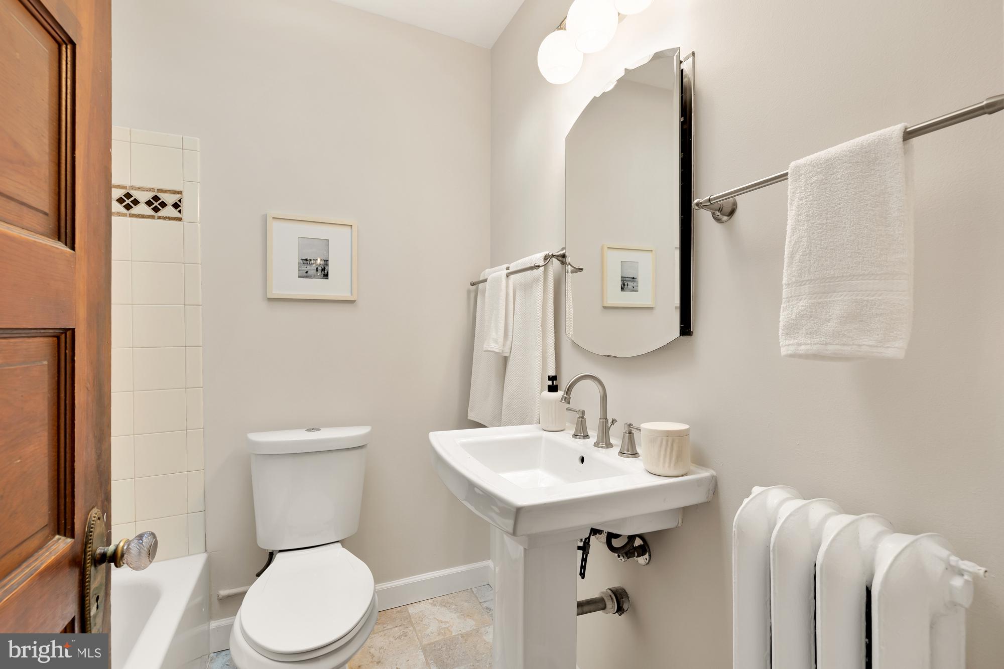 28 Bryant Street Northeast Washington, DC 20002 - Photo 29 of 41 a bathroom with a sink a toilet and mirror