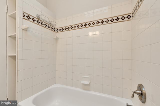 a bathroom with a shower and a bathtub