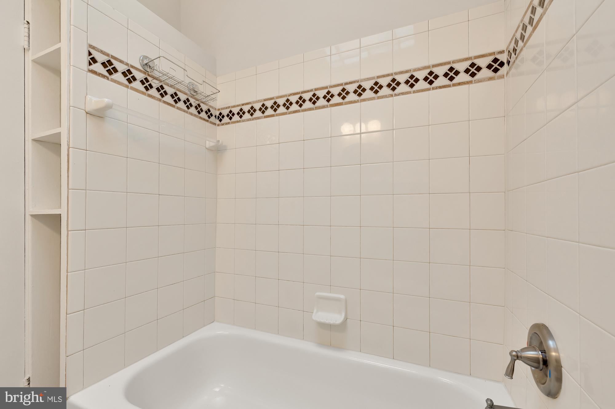 28 Bryant Street Northeast Washington, DC 20002 - Photo 30 of 41 a bathroom with a shower and a bathtub