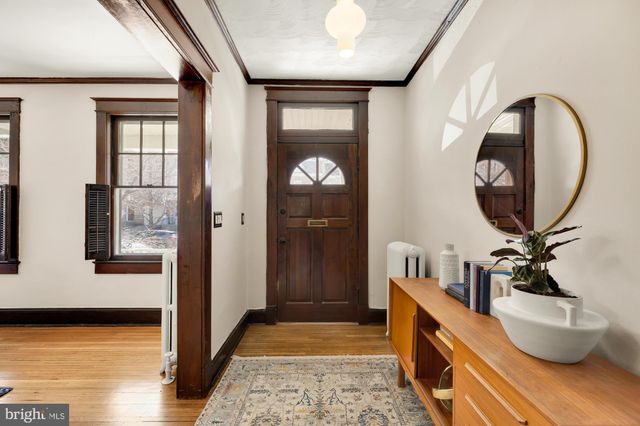 a bathroom with a toilet and a mirror
