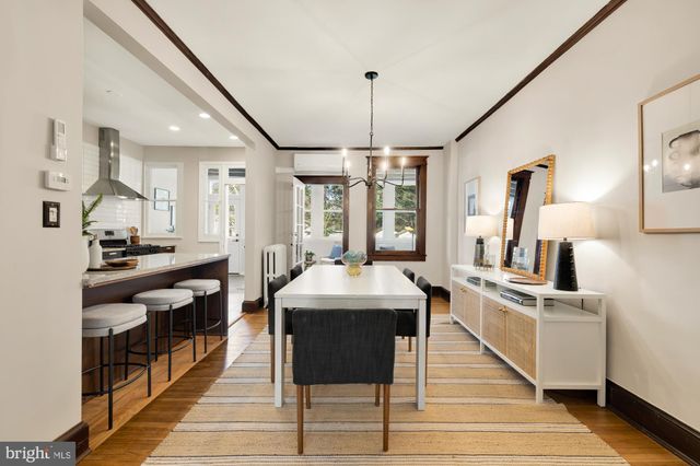 a kitchen with stainless steel appliances kitchen island granite countertop a sink and a stove