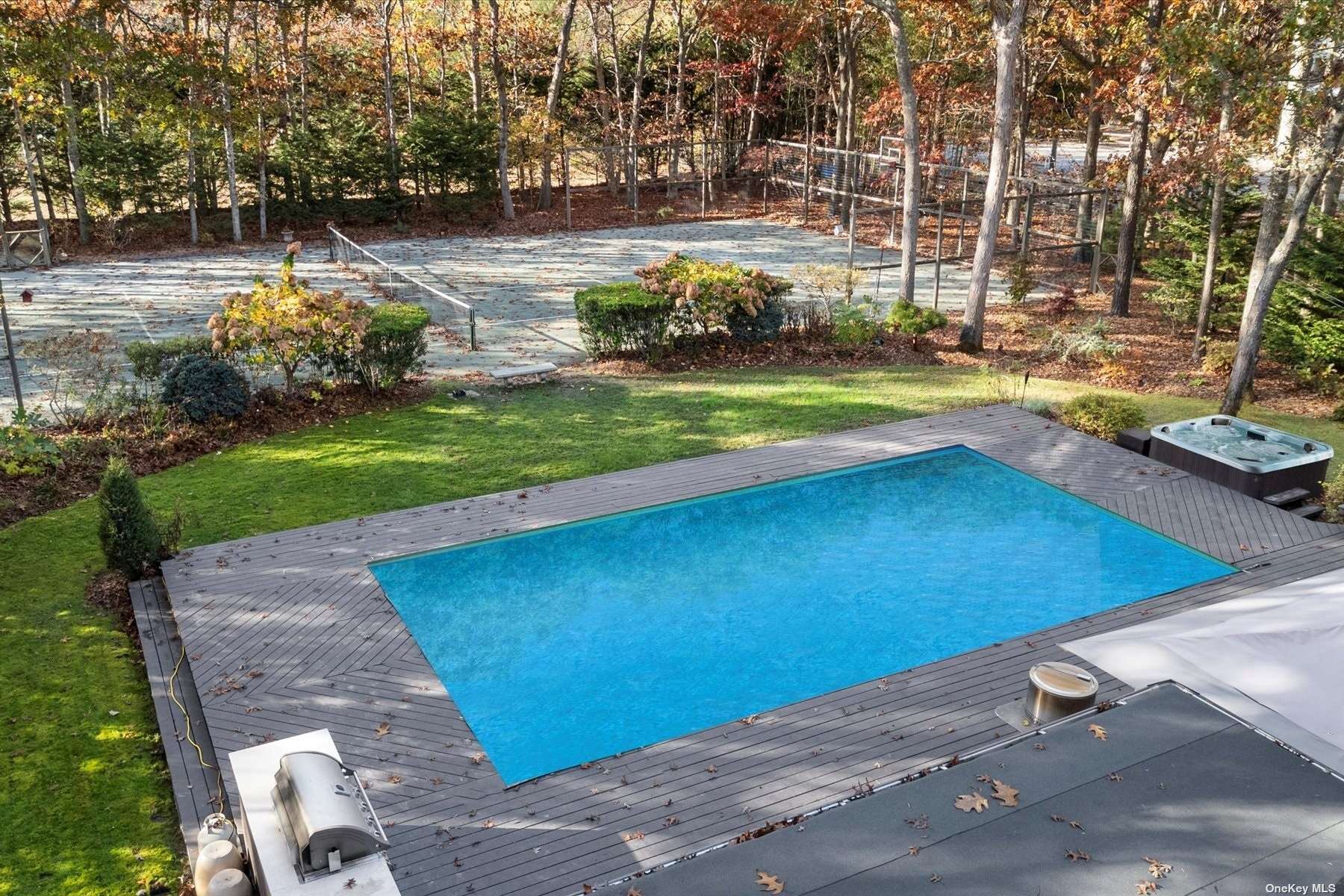 25 Westhampton, undefined 00000 - Photo 23 of 27 a view of yard with swimming pool and green space