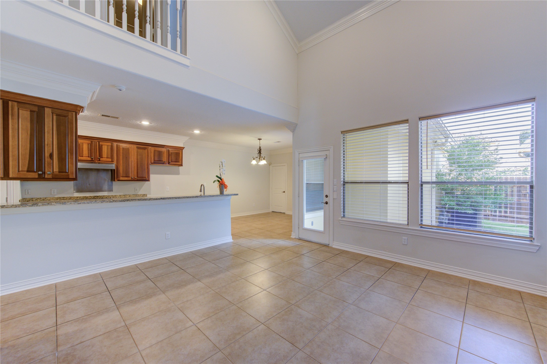 2011 Spring Cedar Lane Houston, TX 77077 - Photo 11 of 43 a view of an empty room with a kitchen