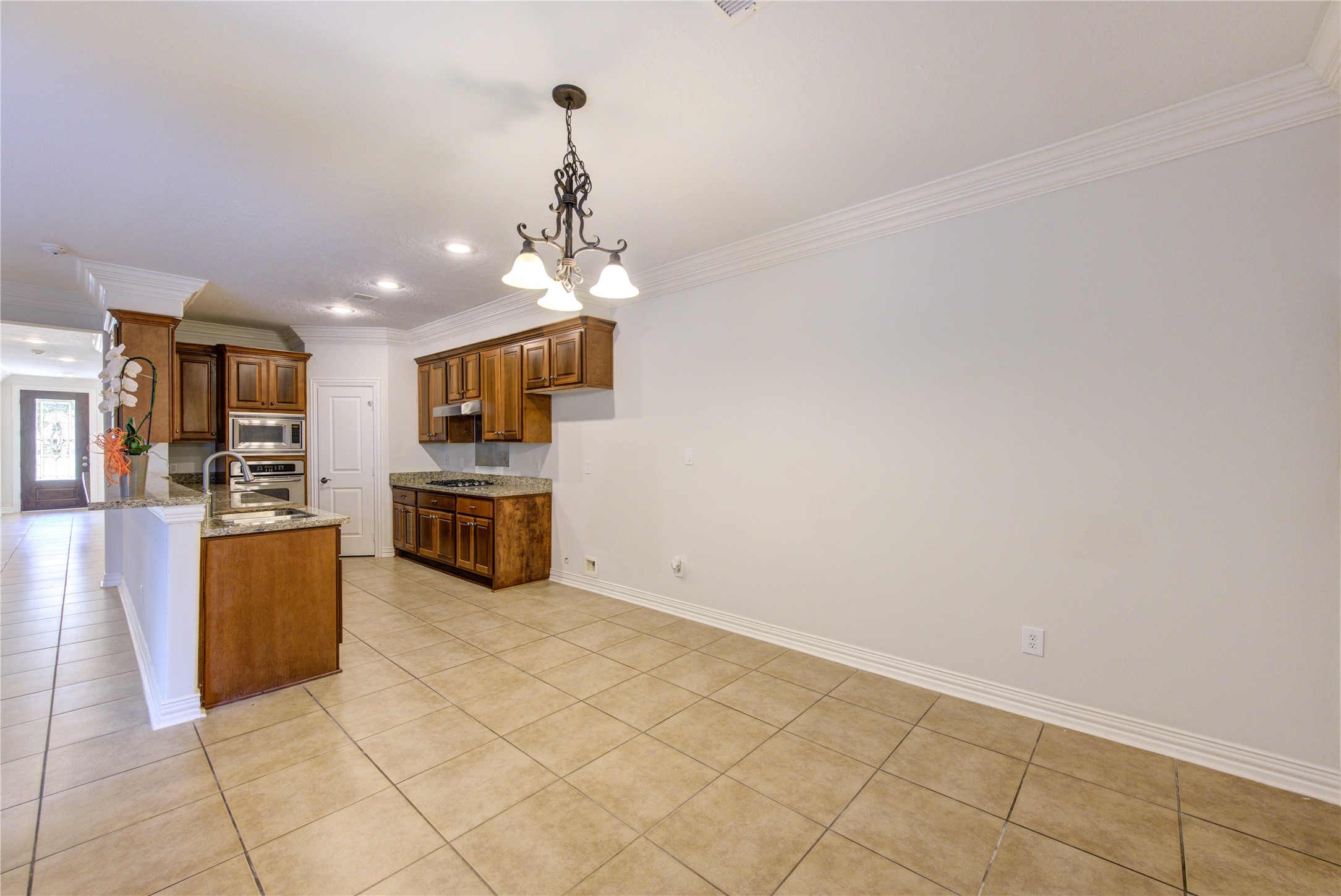 2011 Spring Cedar Lane Houston, TX 77077 - Photo 13 of 43 a kitchen with stainless steel appliances a stove top oven and cabinets