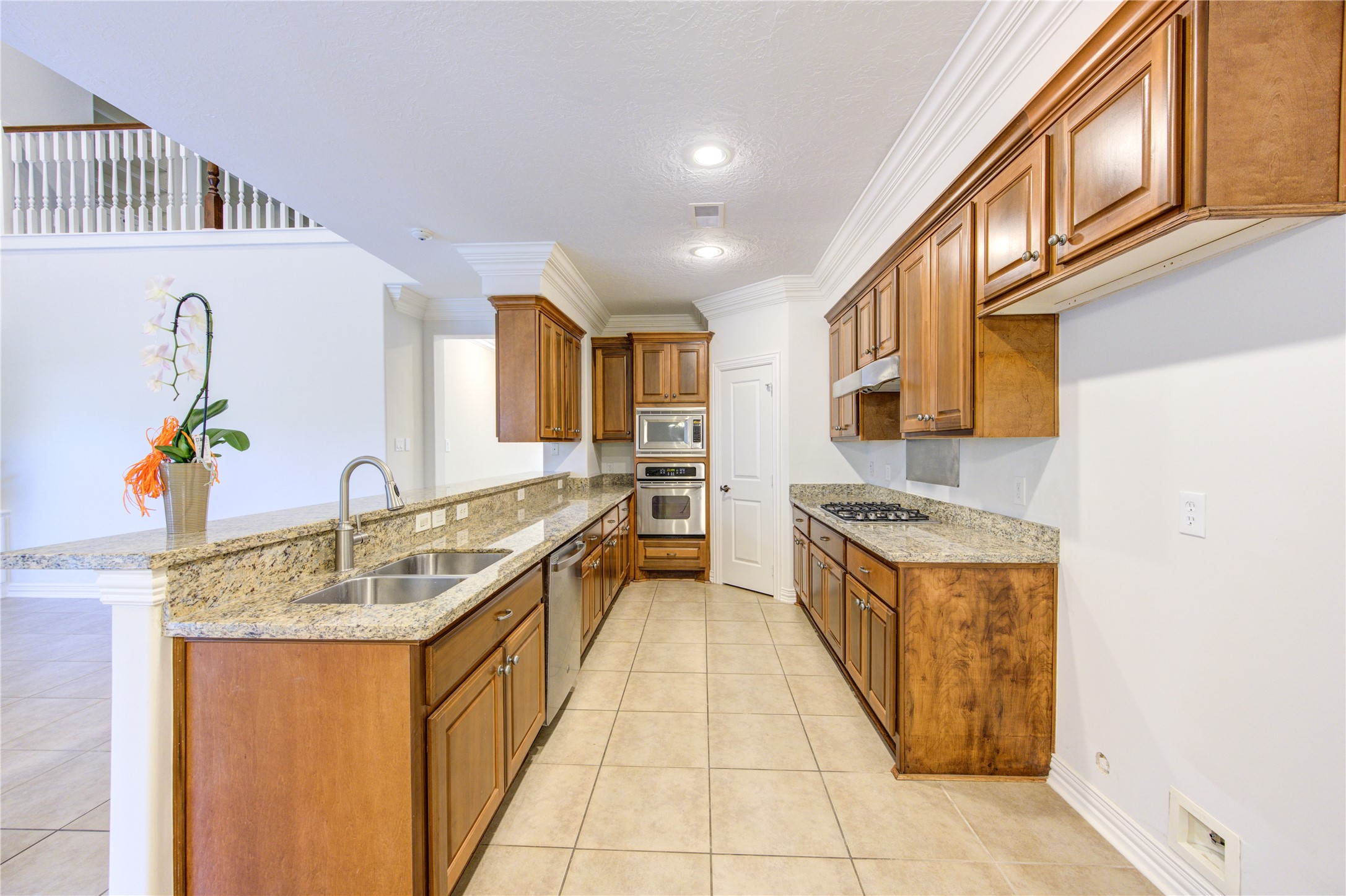 2011 Spring Cedar Lane Houston, TX 77077 - Photo 14 of 43 a kitchen with stainless steel appliances granite countertop a sink and a refrigerator