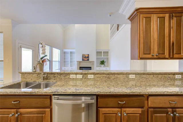 a kitchen with granite countertop a sink and a granite counter tops
