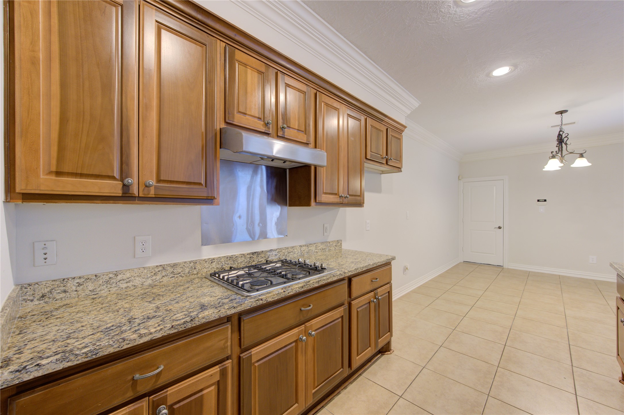 2011 Spring Cedar Lane Houston, TX 77077 - Photo 17 of 43 a kitchen with granite countertop cabinets and steel appliances