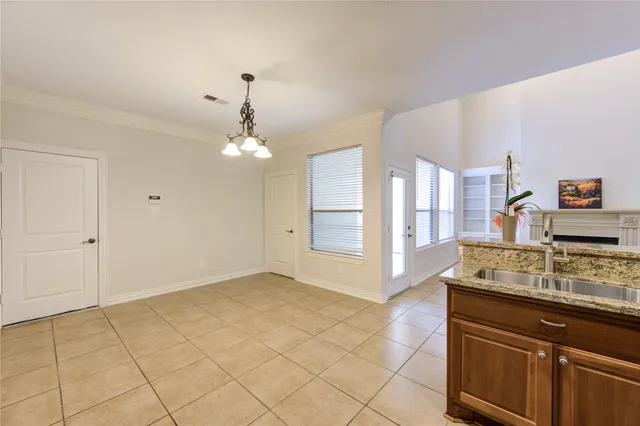 a spacious bathroom with a granite countertop sink a mirror and a shower