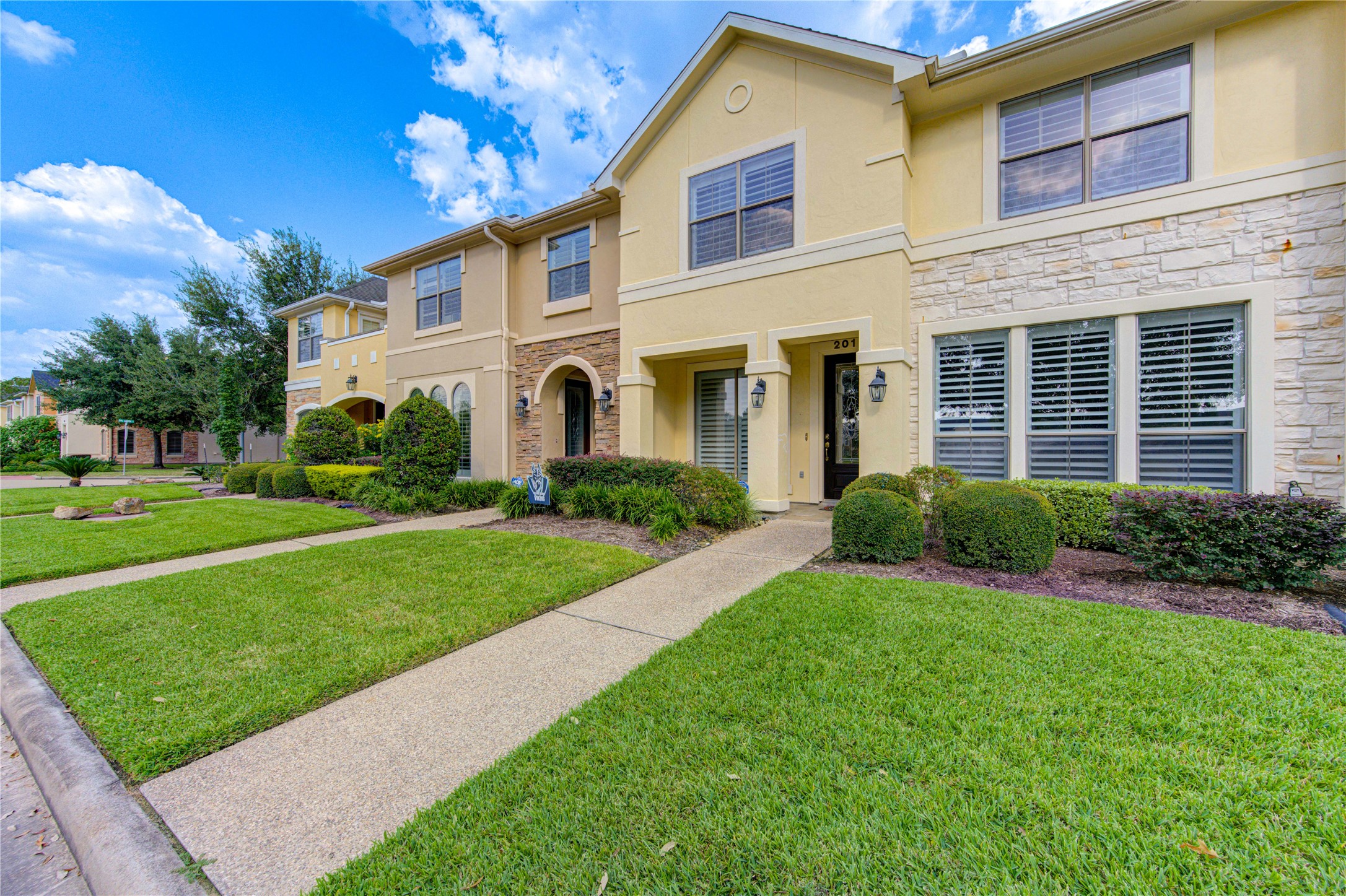 2011 Spring Cedar Lane Houston, TX 77077 - Photo 2 of 43 a front view of a house with a yard