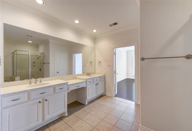 a large bathroom with a double vanity sink mirror and double