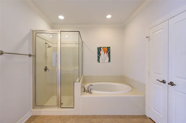 a bathroom with a bathtub and a shower