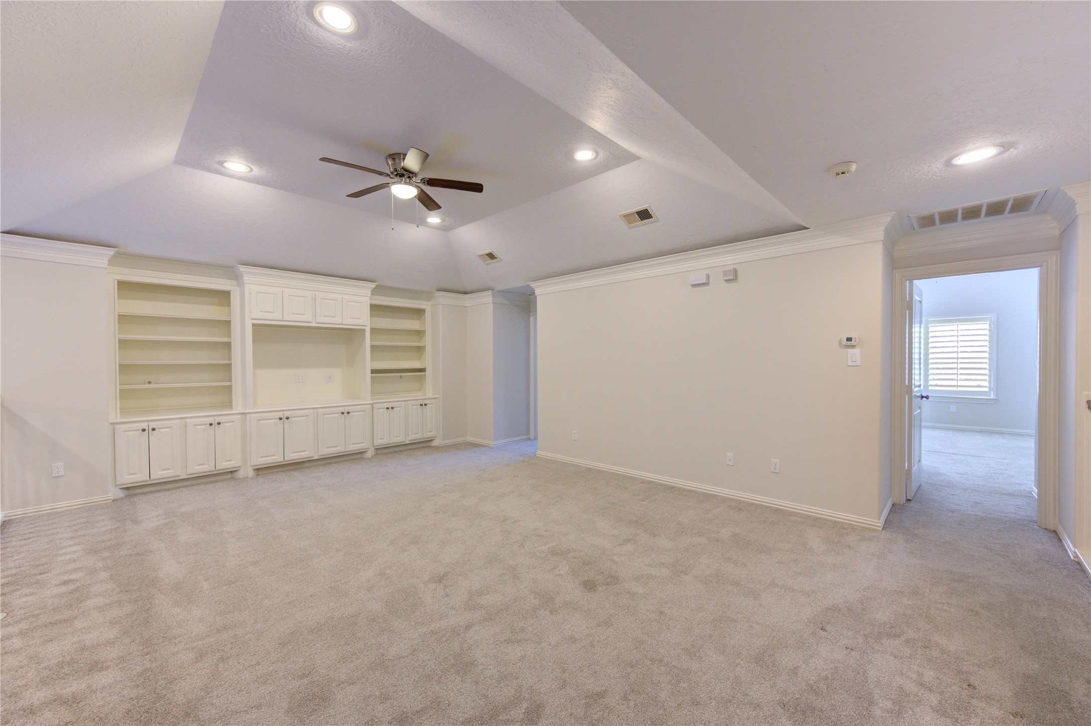2011 Spring Cedar Lane Houston, TX 77077 - Photo 31 of 43 en empty room with closet and ceiling fan