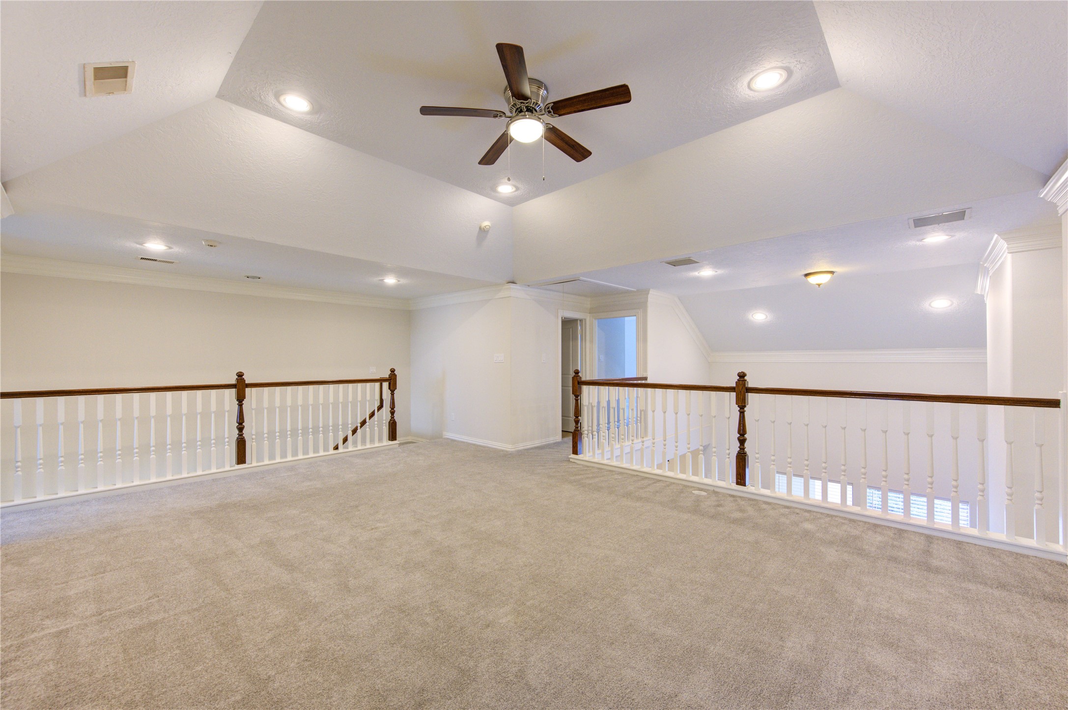2011 Spring Cedar Lane Houston, TX 77077 - Photo 34 of 43 an empty room with ceiling fan and windows