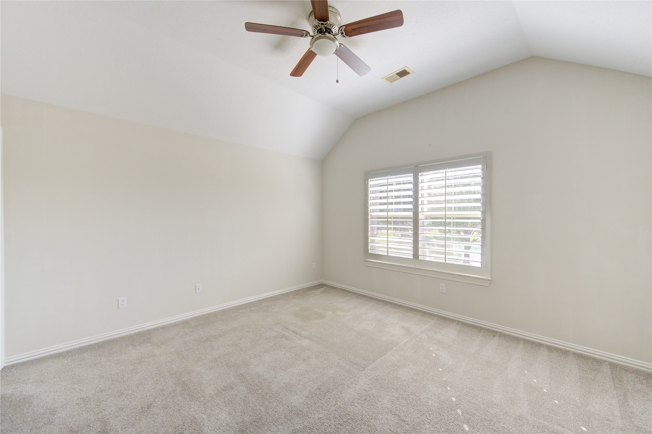 2011 Spring Cedar Lane Houston, TX 77077 - Photo 39 of 43 an empty room with a window and a fan