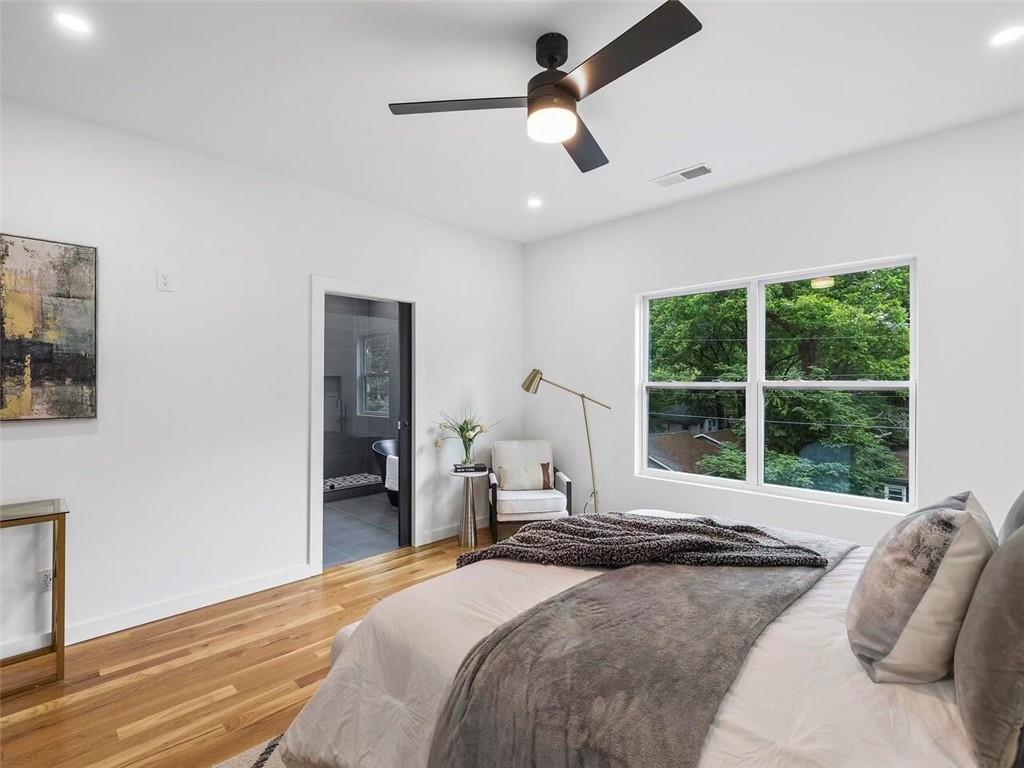 1065 Hubbard Street Southwest Atlanta, GA 30310 - Photo 11 of 20 a bedroom with a bed and a large window