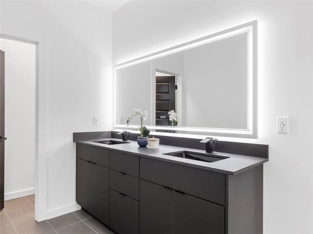 1065 Hubbard Street Southwest Atlanta, GA 30310 - Photo 13 of 20 a bathroom with a sink and a mirror