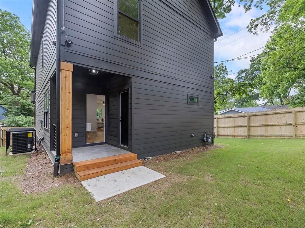 1065 Hubbard Street Southwest Atlanta, GA 30310 - Photo 19 of 20 a front view of a house with garden