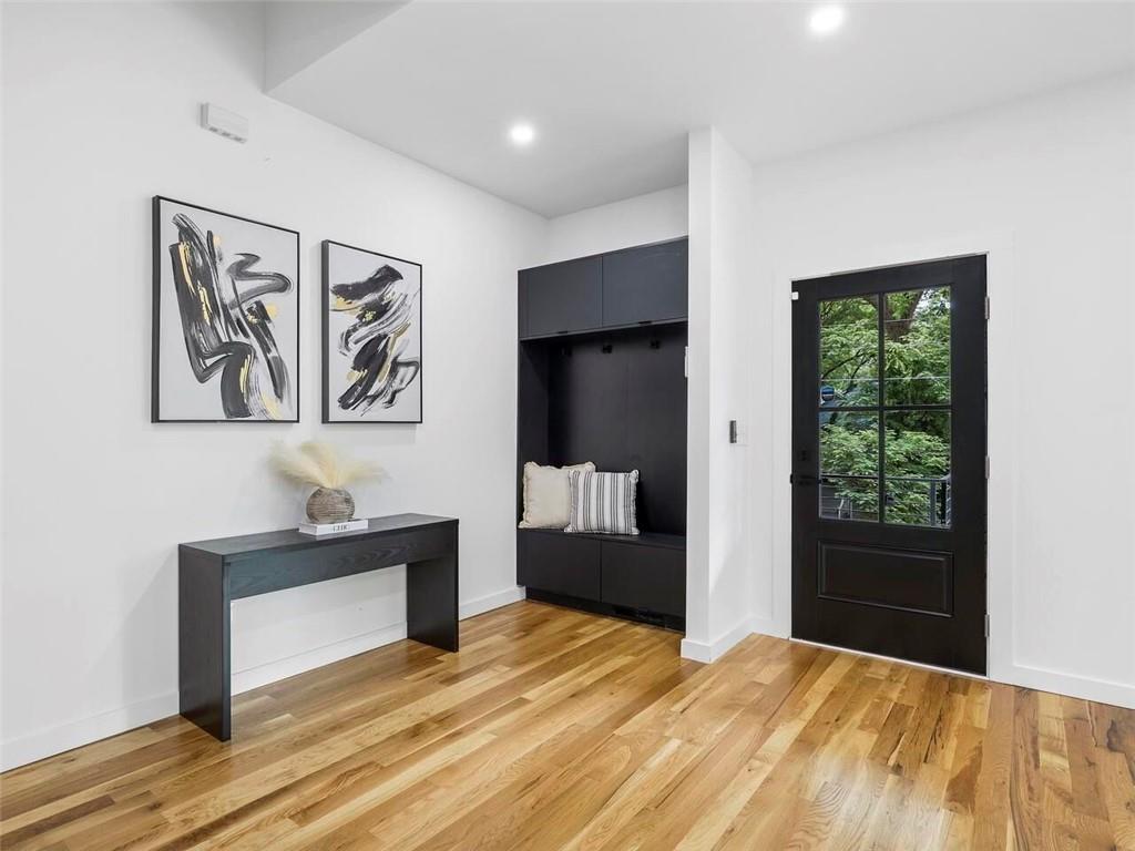 1065 Hubbard Street Southwest Atlanta, GA 30310 - Photo 2 of 20 a bedroom with a bed and a dresser