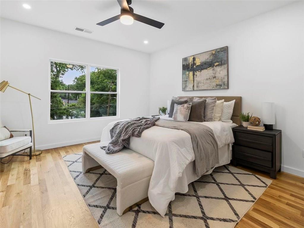 1065 Hubbard Street Southwest Atlanta, GA 30310 - Photo 10 of 20 a bedroom with a bed and a large window