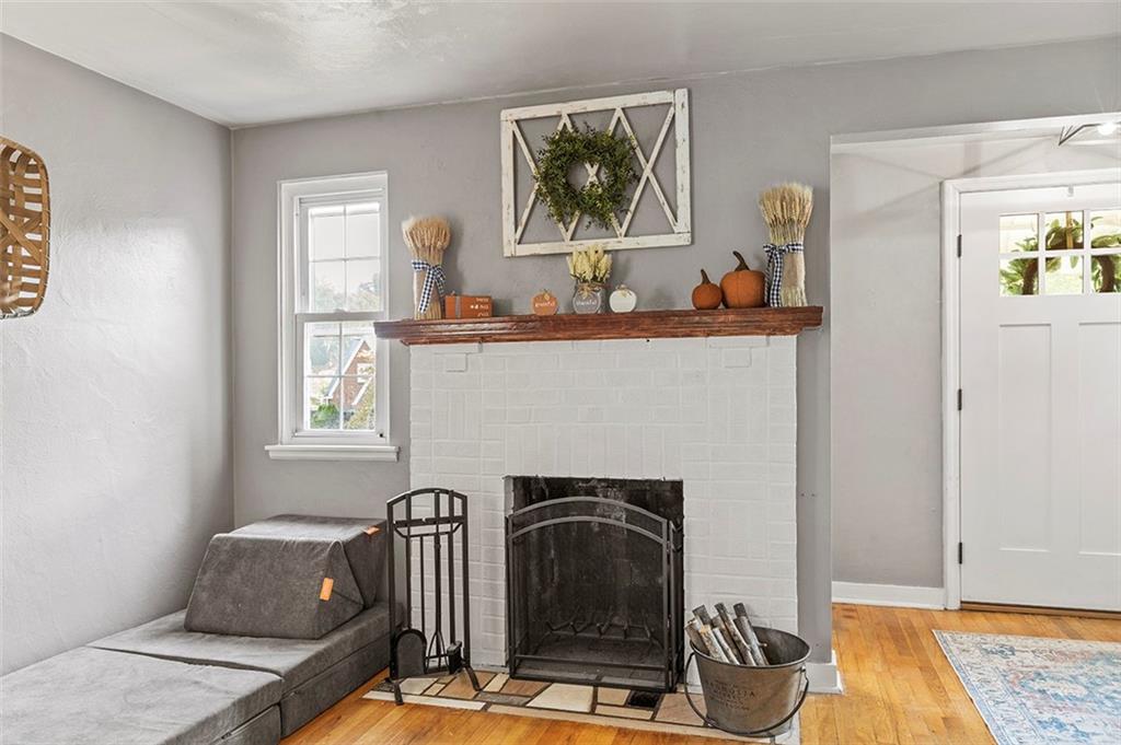 344 Vanadium Road Pittsburgh, PA 15243 - Photo 5 of 29 a living room with furniture and a fireplace