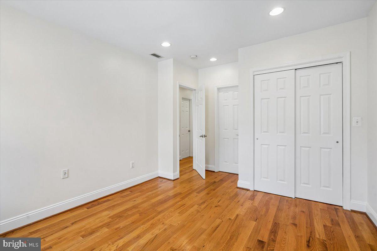 1339 C Street Northeast Washington, DC 20002 - Photo 12 of 24 a view of a room with wooden floor